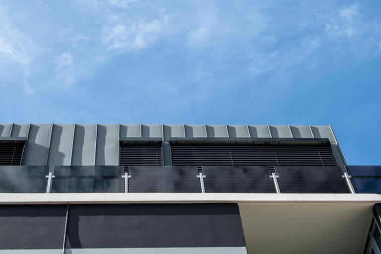 Bridge Road Apartments features Standing Seam and Shingles by Metal