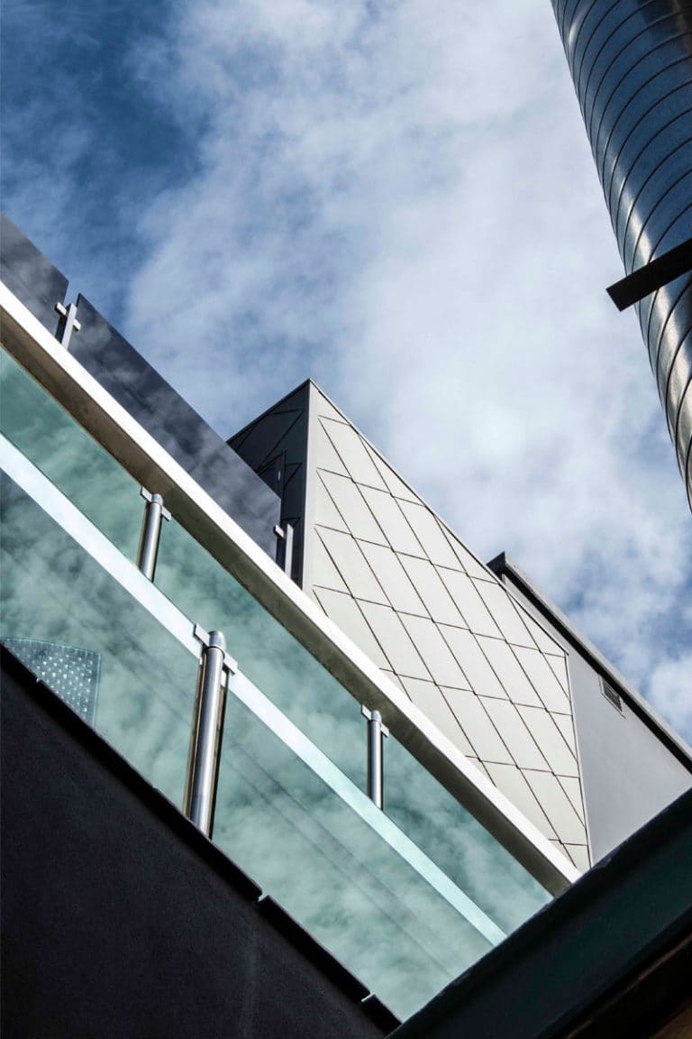 Bridge Road Apartments features Standing Seam and Shingles by Metal